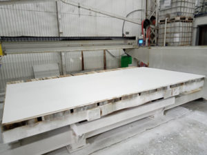 stone benchtop production step of cutting